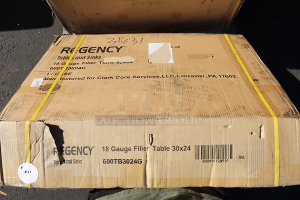 BRAND NEW Regency WT-243038-S 30"x24" stainless steel table in original damaged packaging; may have scratches/dents.