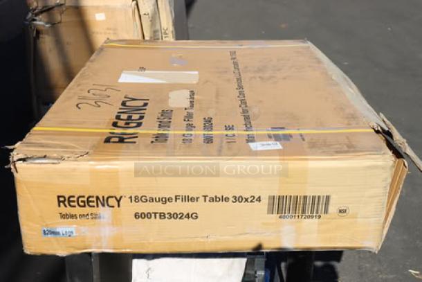 Brand new Regency WT-243038-S 30"x24" 18-gauge stainless steel table in original damaged packaging; may have scratches/dents.