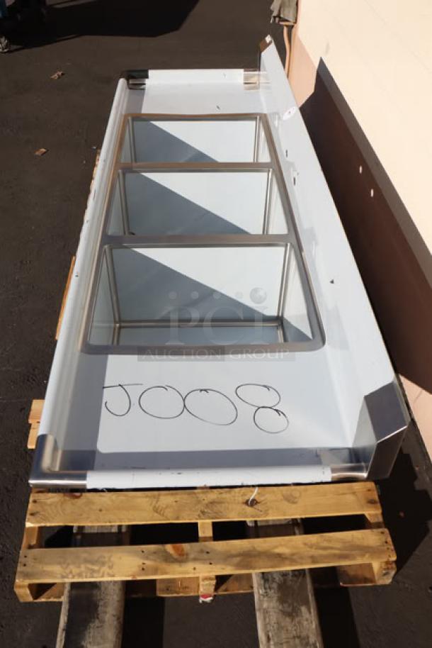 Brand new Regency 94" stainless steel three-compartment commercial sink, model 600S31824218, with galvanized legs and minor scratches.