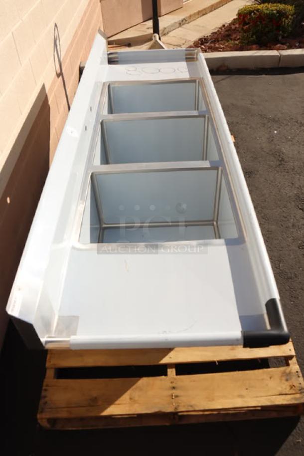 Regency 94" 3-compartment stainless steel sink, model 600S31824218, new with possible minor scratches, galvanized legs, dual drainboards.