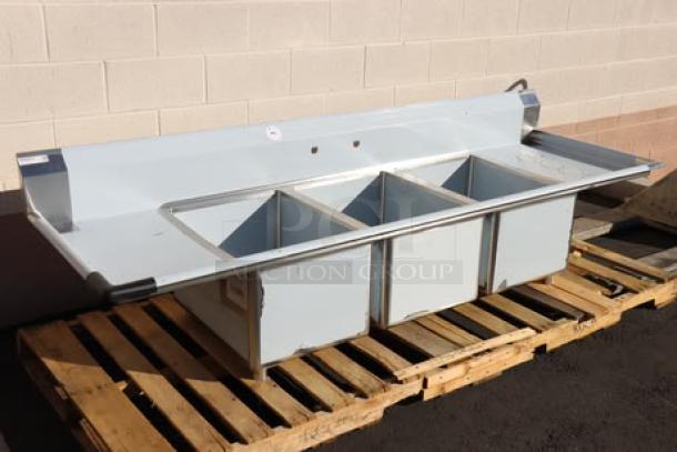 Regency 94" 16 Gauge Stainless Steel 3-Compartment Sink, galvanized legs, 2 drainboards, minor scratches/dents. Model 600S31824218.