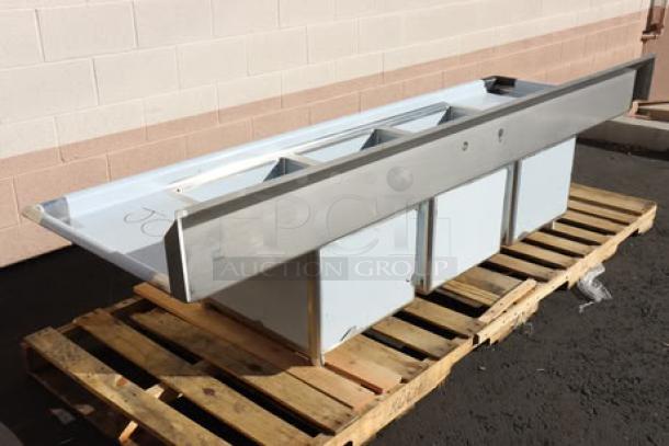 Regency 94" stainless steel three-compartment sink with galvanized legs and two drainboards. Model 600S31824218. New condition with minor scratches/dents.