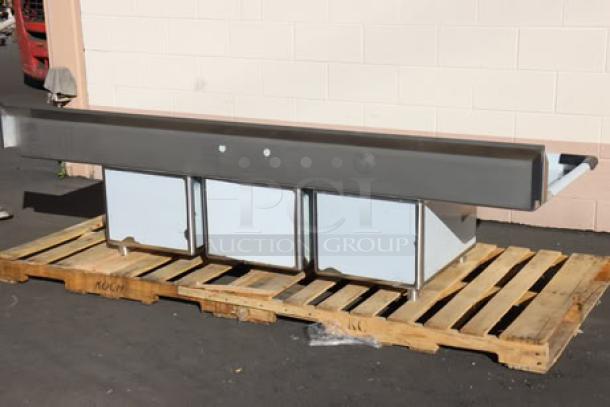 Regency 94" 16 gauge stainless steel commercial sink with three compartments, galvanized legs, and two drainboards; minor scratches/dents.