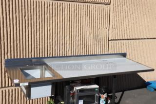 A brand new Regency 30" x 96" stainless steel work table with left sink, model 600ST3096L, no original packaging.