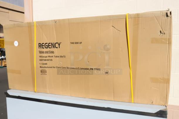 Brand new Regency WT-723038-S-16 work table in original packaging, 30"x72" stainless steel, with 4" backsplash and undershelf.