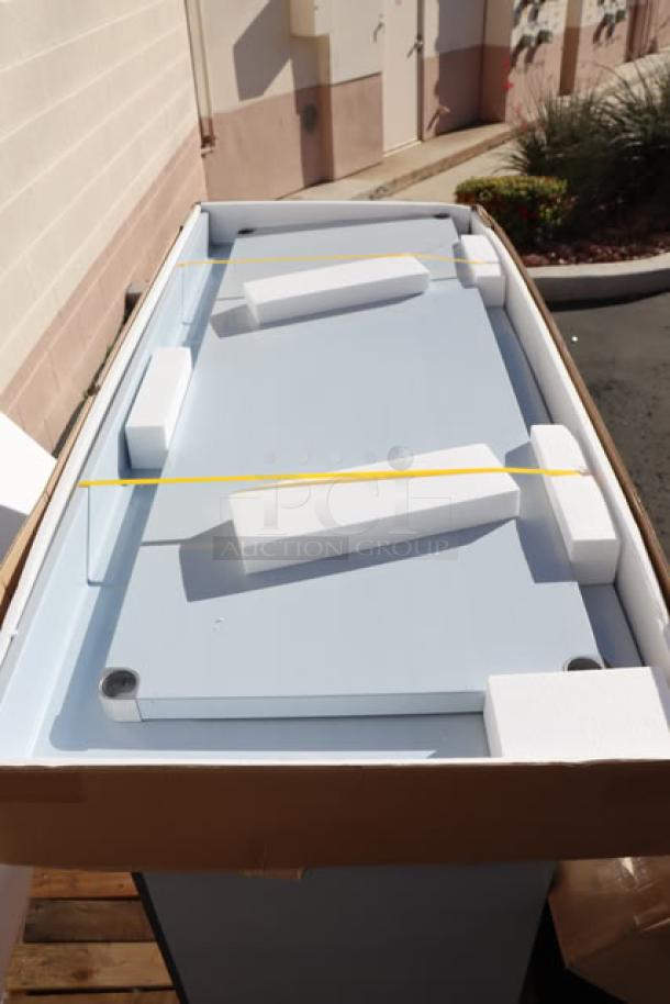 Brand new Regency WT-723038-S-16 stainless steel work table in packaging, 30"x72", with 4" backsplash and undershelf.