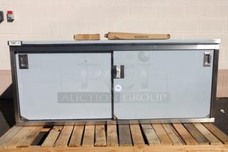 Brand new Regency C-2472-316 stainless steel enclosed base table, 24" x 72", sliding doors, adjustable midshelf.