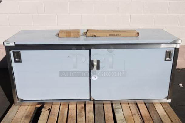 Brand new Regency C-2472-316 stainless steel table, enclosed base, sliding doors, adjustable midshelf, minor scratches.