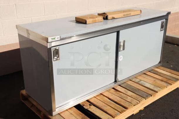 BRAND NEW Regency C-2472-316 24"x72" stainless steel table with sliding doors, enclosed base, adjustable midshelf, minor scratches.