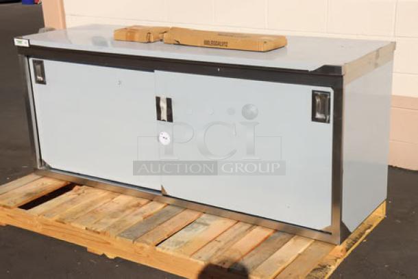 Brand new Regency C-2472-316 stainless steel table, 24"x72" with sliding doors and adjustable midshelf, scratch-n-dent condition.