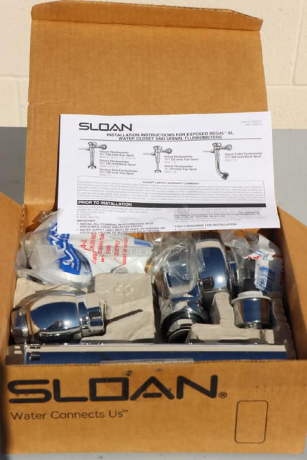 BRAND NEW Sloan 3080050 Regal Flushometer, chrome finish, 1.28 GPF, top spud, with installation instructions in original box.