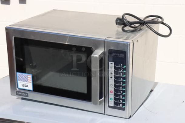 Brand new Amana RCS10TS commercial microwave, 1000W, 120V, with push button controls. Visible USA label. Model has minor cosmetic marks.