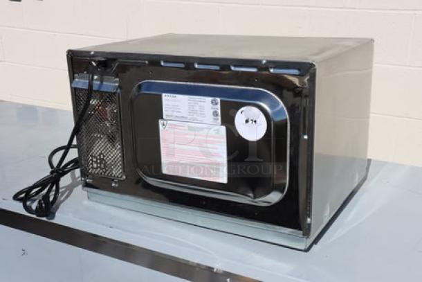 BRAND NEW Amana RCS10TS stackable commercial microwave, 120V, 1000W, with push button controls, slight scratches visible.