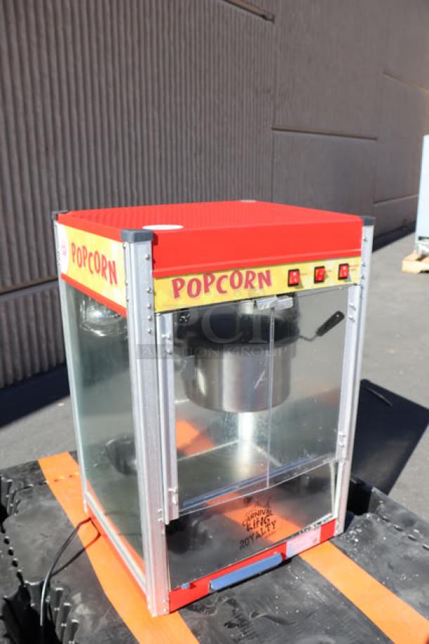 Carnival King PM50NR 12 oz. Red Popcorn Machine, Royalty Series, clear panels, visible "POPCORN" label, 120V, excellent condition.