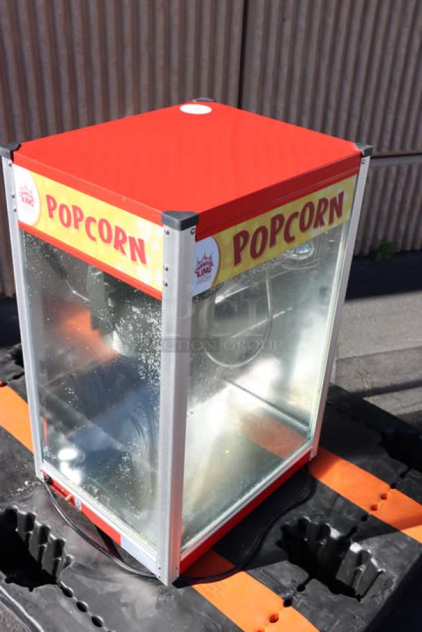 Carnival King PM50NR Red Popcorn Machine, 12 oz capacity, commercial, clear panels, branding on sides, used condition.