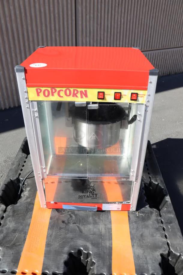 Carnival King PM50NR 12 oz. red popcorn machine, glass front, "Royalty Series," in good condition, 120V.