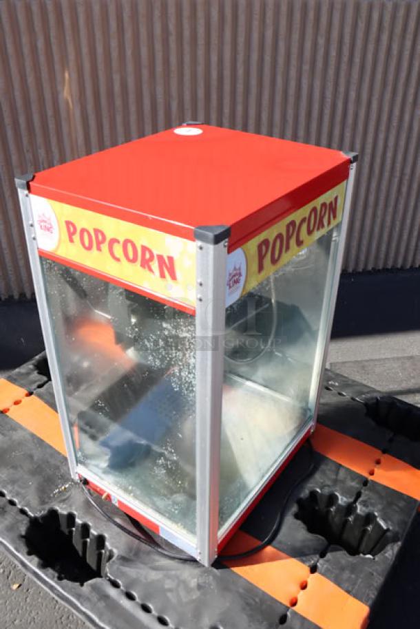 Carnival King PM50NR Royalty Series 12 oz. red popcorn machine, glass walls, "Popcorn" label, commercial use, 120V.