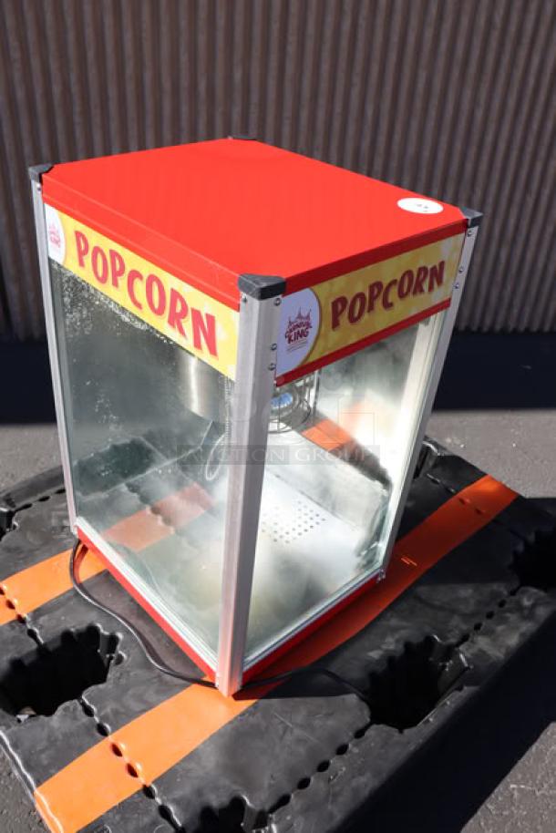 Carnival King PM50NR 12 oz. red popcorn machine; glass sides, metal body, "POP" decals. Excellent condition, 120V.