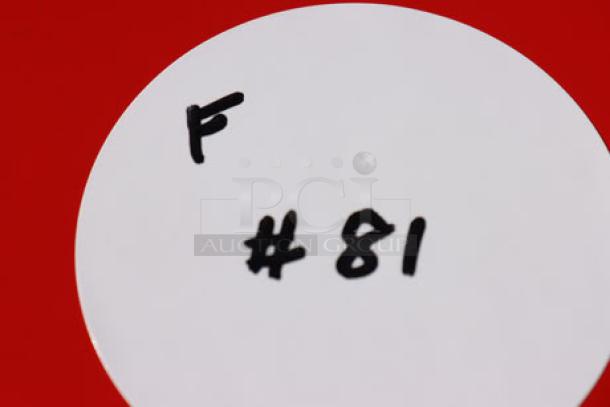 Circular white tag labeled "F #81" against a red background.
