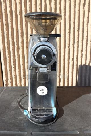 Bunn 55600.0100 GVH-1 Coffee Grinder, stainless steel, slightly used, serial number GVH0006397, on table surface.