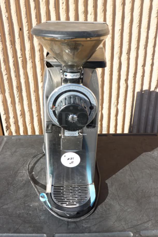 Bunn 55600.0100 GVH-1 stainless steel bulk coffee grinder, 120V, used, S/N: GVH0006397, visible wear, partially obscured label.