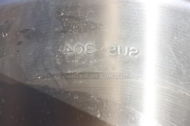Stainless steel surface with "SUS 304" marking, indicating high-quality steel grade.
