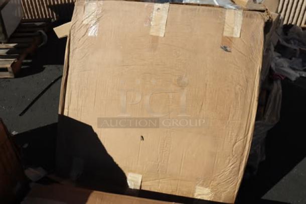 Two pallets containing a mix of new and boxed kitchen items and furniture. Damaged packaging.