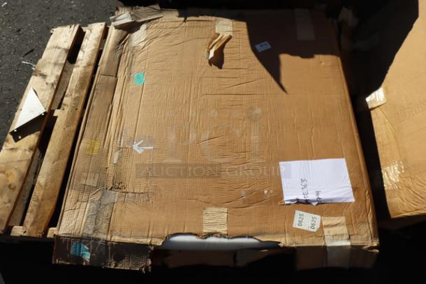 Two pallets with damaged packaging containing a mixed lot, including a Regency grease trap, a Bunn coffee grinder, metal barstool, table tops, a Steelton sink, and more.