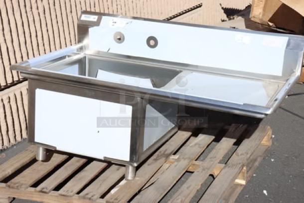 Brand new Regency 600S1242424R stainless steel sink with right drainboard; 50.5" wide, minor scratches, on pallet.
