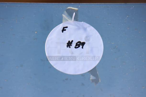 White circular tag labeled "F #87" attached with tape.