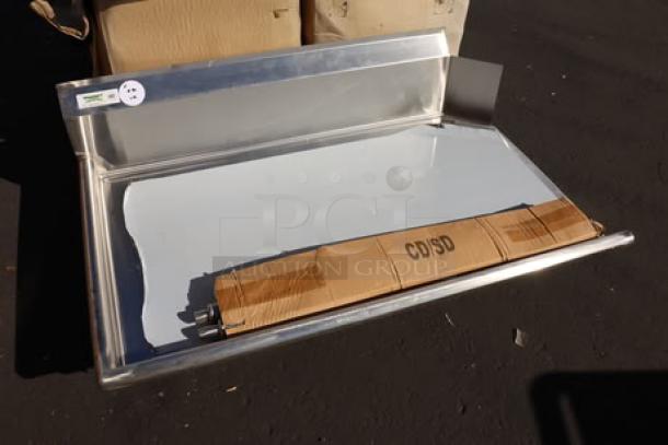Regency 4' clean dish table with left drainboard, scratch and dent, out of packaging, includes packaging box labeled "CDISD."