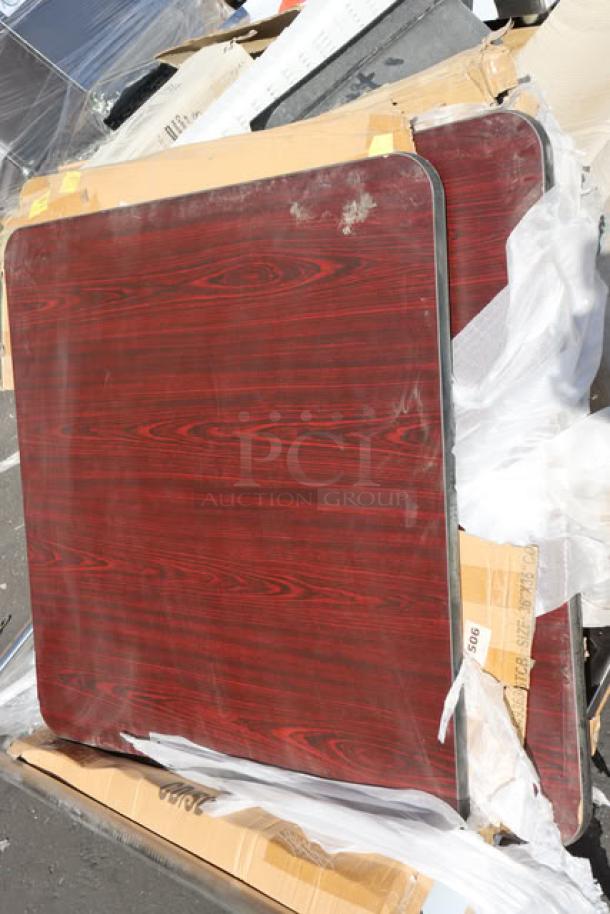 Reversible cherry/black laminated square table top, 36" x 36", visible in packaging, slight scratches noted, brand new condition.