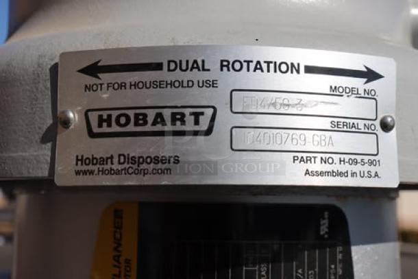 Hobart FD4/50-3 Commercial Garbage Disposer label showing dual rotation, model, serial, and part numbers.