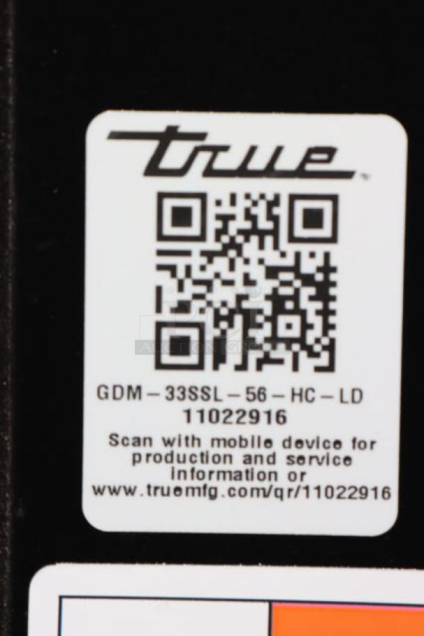 QR code and label for True GDM-33SSL-56-HC-LD merchandiser refrigerator. Model details and QR code for service info visible.