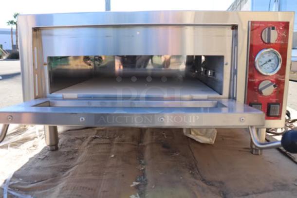 Avantco DPO-18-S Single Deck Countertop Pizza/Bakery Oven, 1700W, 120V. Stainless steel body, front view with open door.