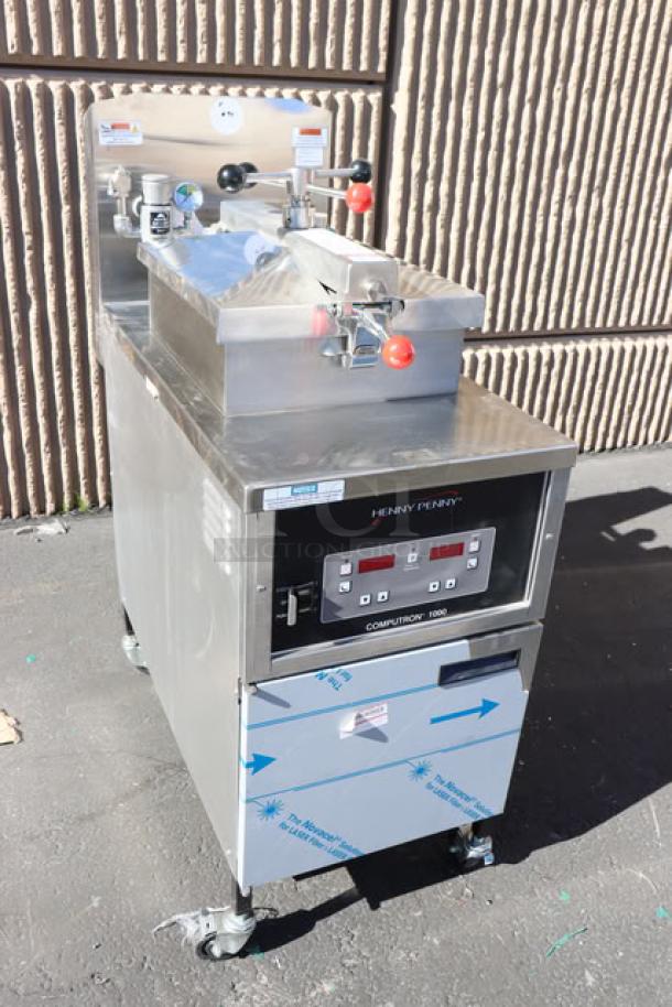 BRAND NEW Henny Penny PFE500 4-Head Electric Pressure Fryer, Computron 1000 Controls, 208V, 3 Phase. Minor scratches/dents.