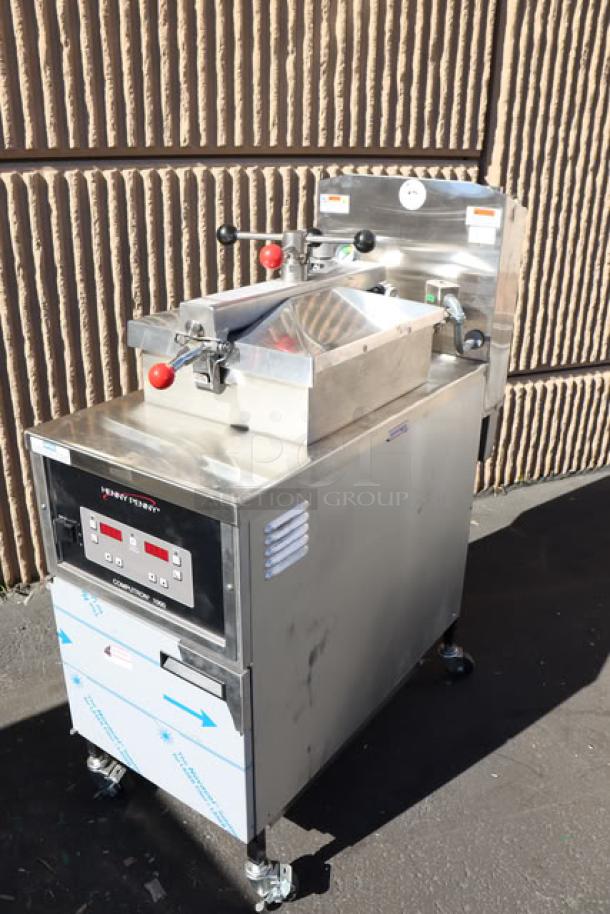 Brand new Henny Penny PFE500 electric pressure fryer with Computron 1000 controls, 4-head, 208V, 3-phase; minor scratches.