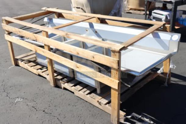 Brand new Regency S3C182414-24RT three-compartment stainless steel sink in wooden crate. Right drainboard, 16-gauge steel.