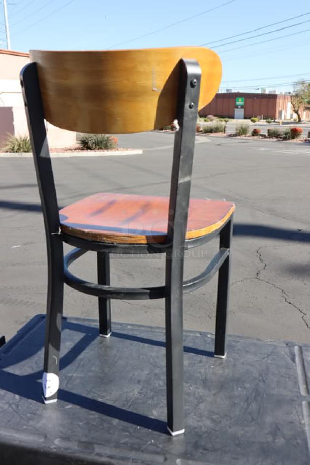 Brand new Lancaster Boomerang chair, black frame, vintage wood seat and back, model 164CBMRNGBVV, minor scratches.