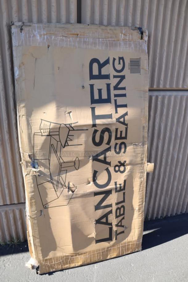 Lancaster Table & Seating folding table in damaged original packaging, featuring a 30" x 60" granite white plastic top with sage gray legs.