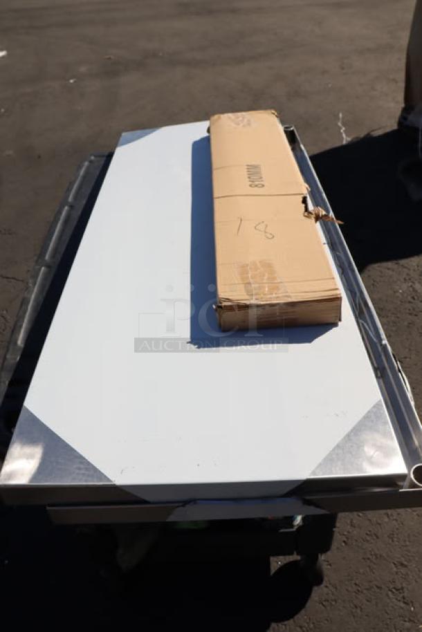 7-piece auction lot on a cart; includes boxed items: chairs, overshelf, stanchion, griddle, utility sink, mop sink. Brand new.