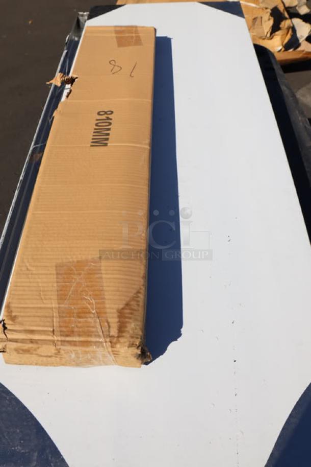 A boxed 7-piece auction lot including chairs, shelves, griddle top, and sinks, visible cardboard packaging showing item codes.