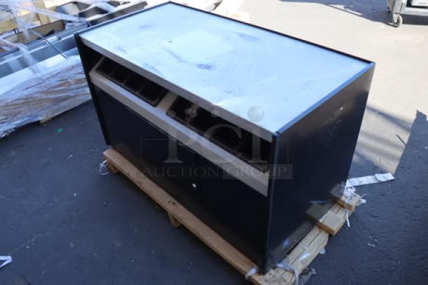 All State Manufacturing coffee stand, 49" x 23 1/4" x 34", model OCS490. Features two condiment trays. Top panel dented and scratched.