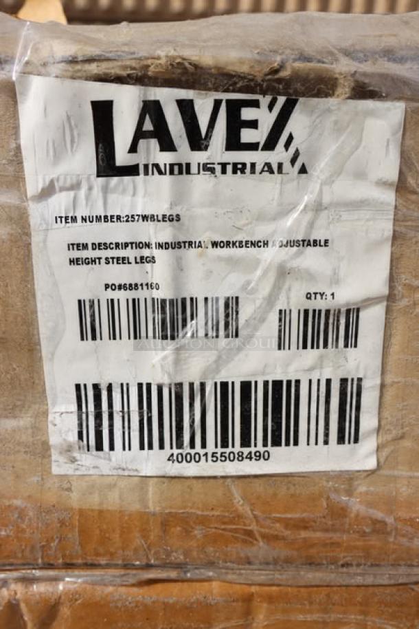 Three cases of Lavex Adjustable Height Steel Leg Set for workbenches, model 257wblegs, in damaged packaging.