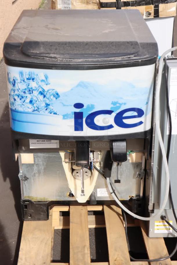 BRAND NEW Manitowoc UDF0240W ice machine with 90 lb. bin, scratch-n-dent condition, water-cooled. Includes Servend 2706334 M45 ice dispenser, 45 lb. capacity.