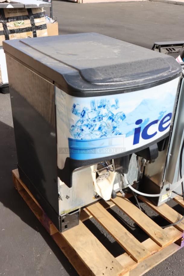 Manitowoc UDF0240W undercounter ice machine, new with minor scratches. Includes 90 lb. bin, 197 lb. capacity. Visible ice graphics.