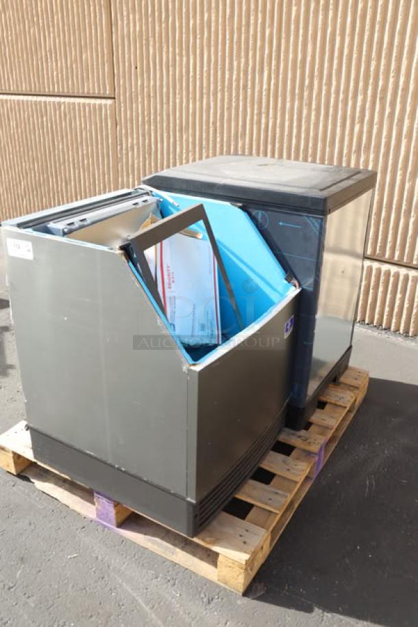 Manitowoc UDF0240W water-cooled ice machine with 90 lb. bin and Servend M45 dispenser on pallet. Brand new, scratch-n-dent condition.