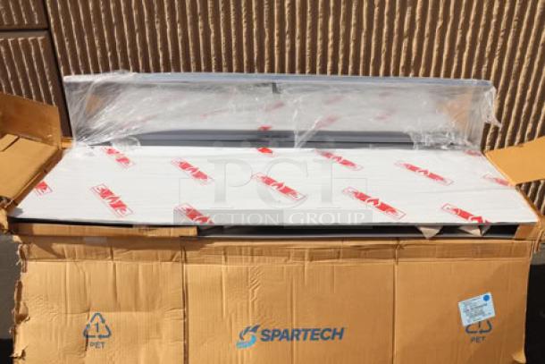 Brand new Cooking Performance Group 351059006 backsplash assembly, out of original packaging, shown in a Spartech box.