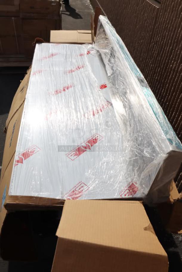 Brand new Cooking Performance Group 351059006 backsplash assembly wrapped in protective plastic, out of original packaging.