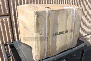 Cardboard box labeled "600LDR2318," indicating Regency liquor display rack, shows signs of mild wear from storage.